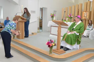 Bible is place on the Altar